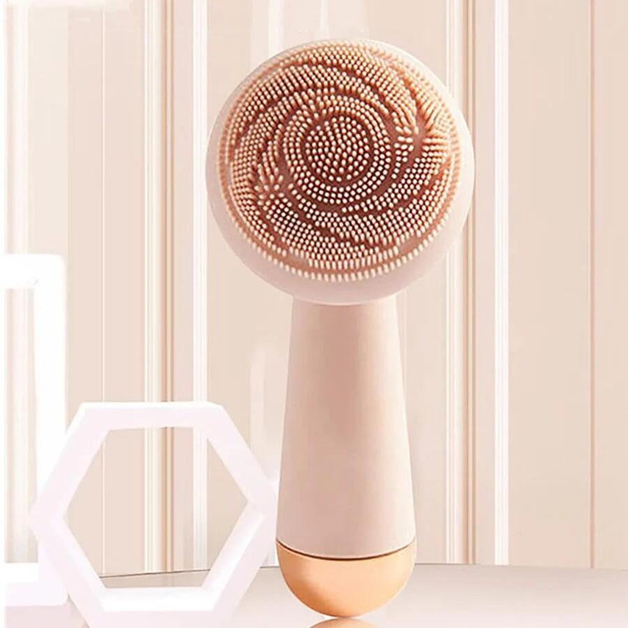 Cepillo facial eléctrico rosa recargable de innovagizmo.com, con cabezal suave y diseño ergonómico para limpieza facial.