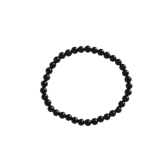 Pulsera de mineral Ónix con bolas lisas, joyería elegante y natural, ideal para accesorios de estilo místico y espiritual.