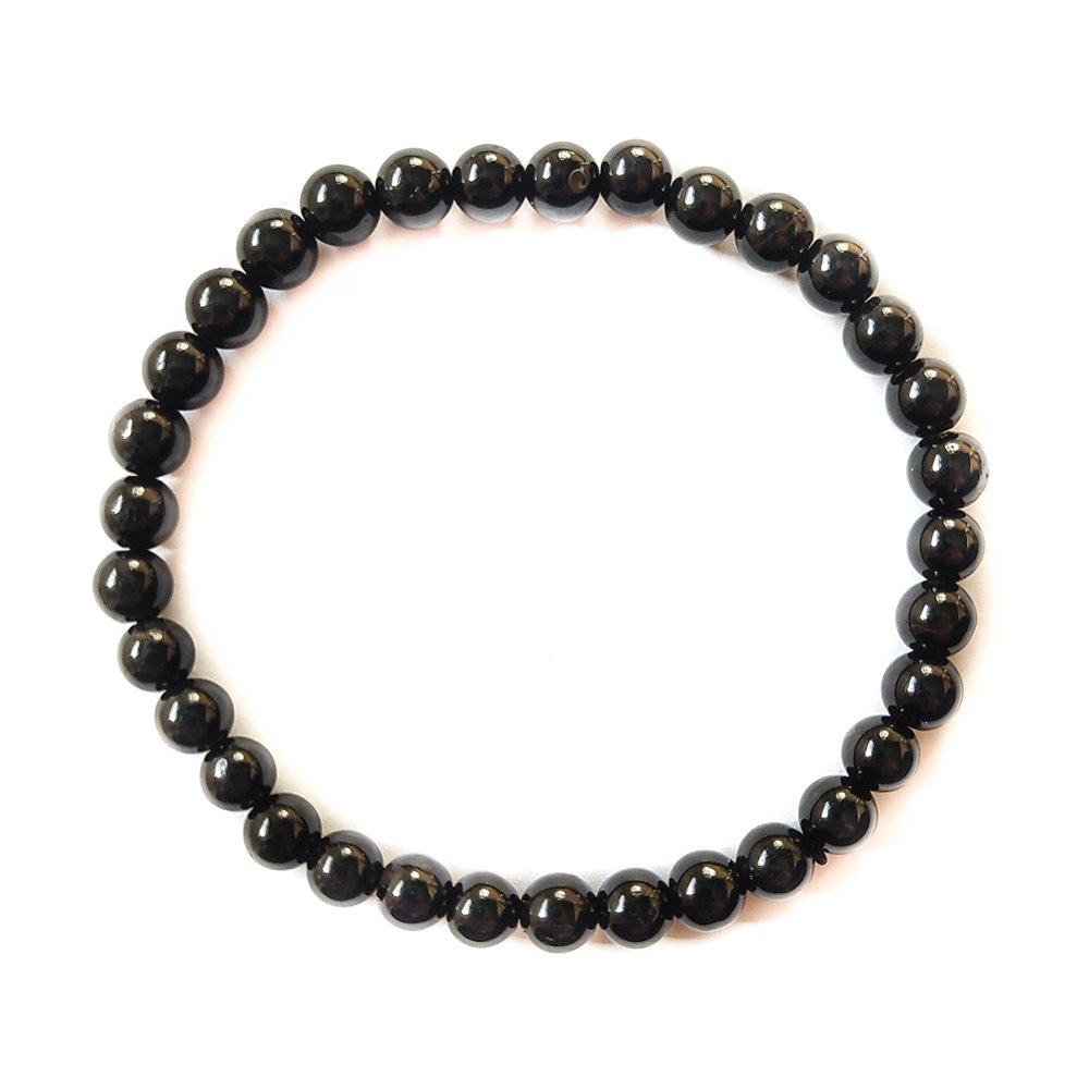 Pulsera de mineral Turmalina Negra con bolas lisas, accesorio de joyería de Mystical Tienda, muestra las cuentas negras redondas.