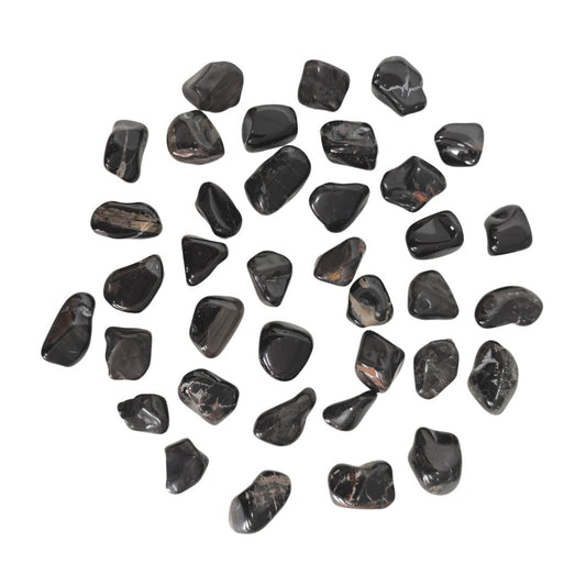 Rodado de ónix negro de la marca Mystical Tienda, con acabado pulido y superficie lisa.