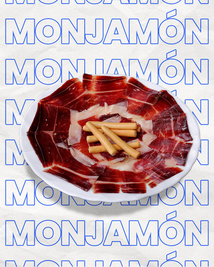 Jamón Gran Reserva de 80g de MONJAMON Y MAS, cortado a cuchillo, con lonchas finas y color rubí intenso.