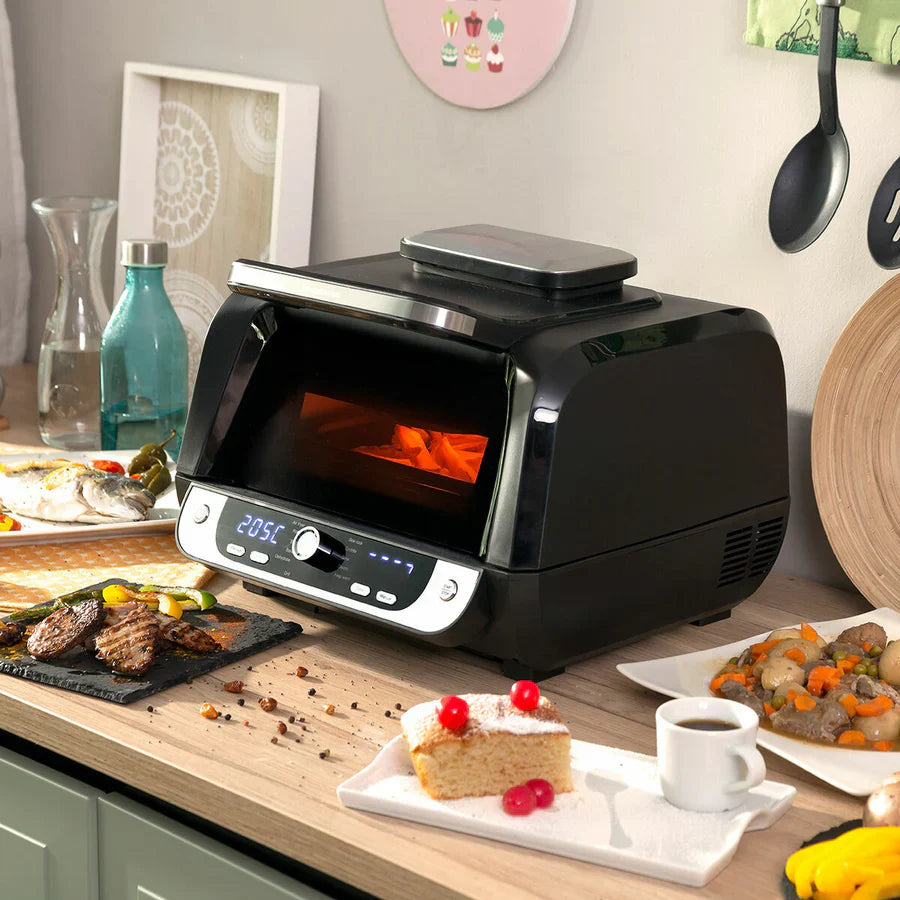 Freidora de aire con grill InnovaGoods Fryinn 12-en-1 en color negro, accesorios y recetario, capacidad de 6L y potencia de 3400W.