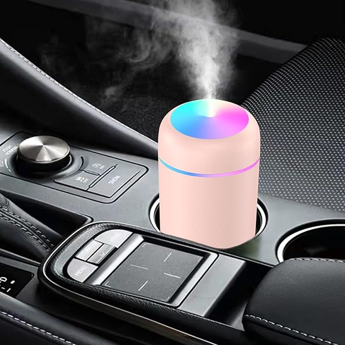 Humidificador Dropea LED rosa de Innovagizmo con luz suave y diseño compacto en una superficie.
