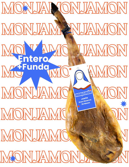 Jamón Gran Reserva de 36 meses de la marca MONJAMÓN Y MÁS, con lonchas finas y color intenso en una tabla.