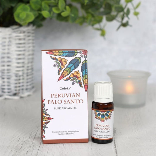 Esencia de Palo Santo Goloka en botella de vidrio, ideal para aromaterapia y rituales espirituales, de la marca Mystical Tienda.
