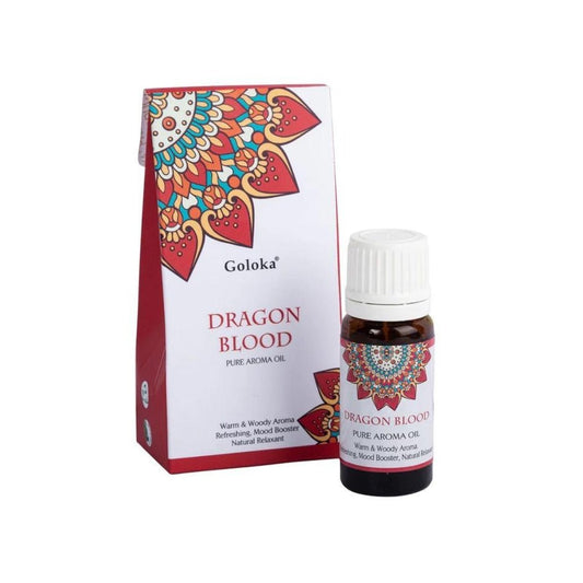 Esencia de Sangre de Dragón Goloka en frasco, aroma místico, utilizada en rituales y prácticas espirituales, marca Mystical Tienda.