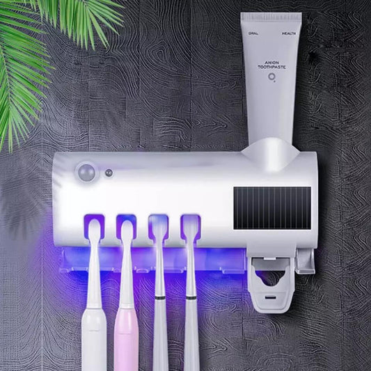 Esterilizador UV 3 en 1 para cepillos de dientes con dispensador de pasta, en color blanco y compacto para higiene bucal.