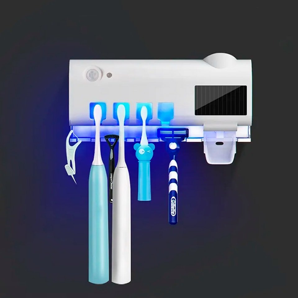 Esterilizador UV para cepillos de dientes 3 en 1 con dispensador de pasta, en color blanco y diseño compacto.