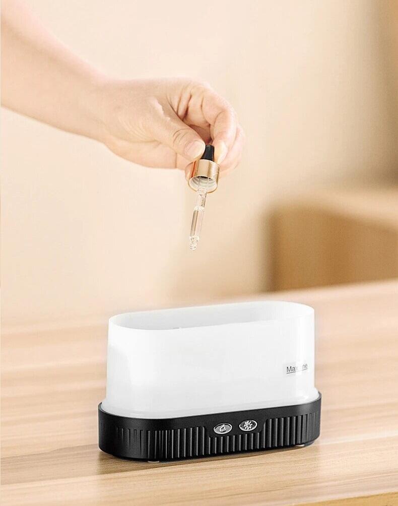 Humidificador efecto llamas Innovagizmo con diseño de llamas iluminadas y vapor en color naranja y rojo.
