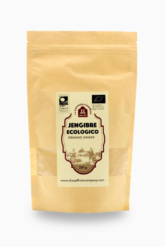 Polvo de jengibre ecológico de la marca The Saffron Company JJ, muestra el polvo de jengibre en un recipiente.