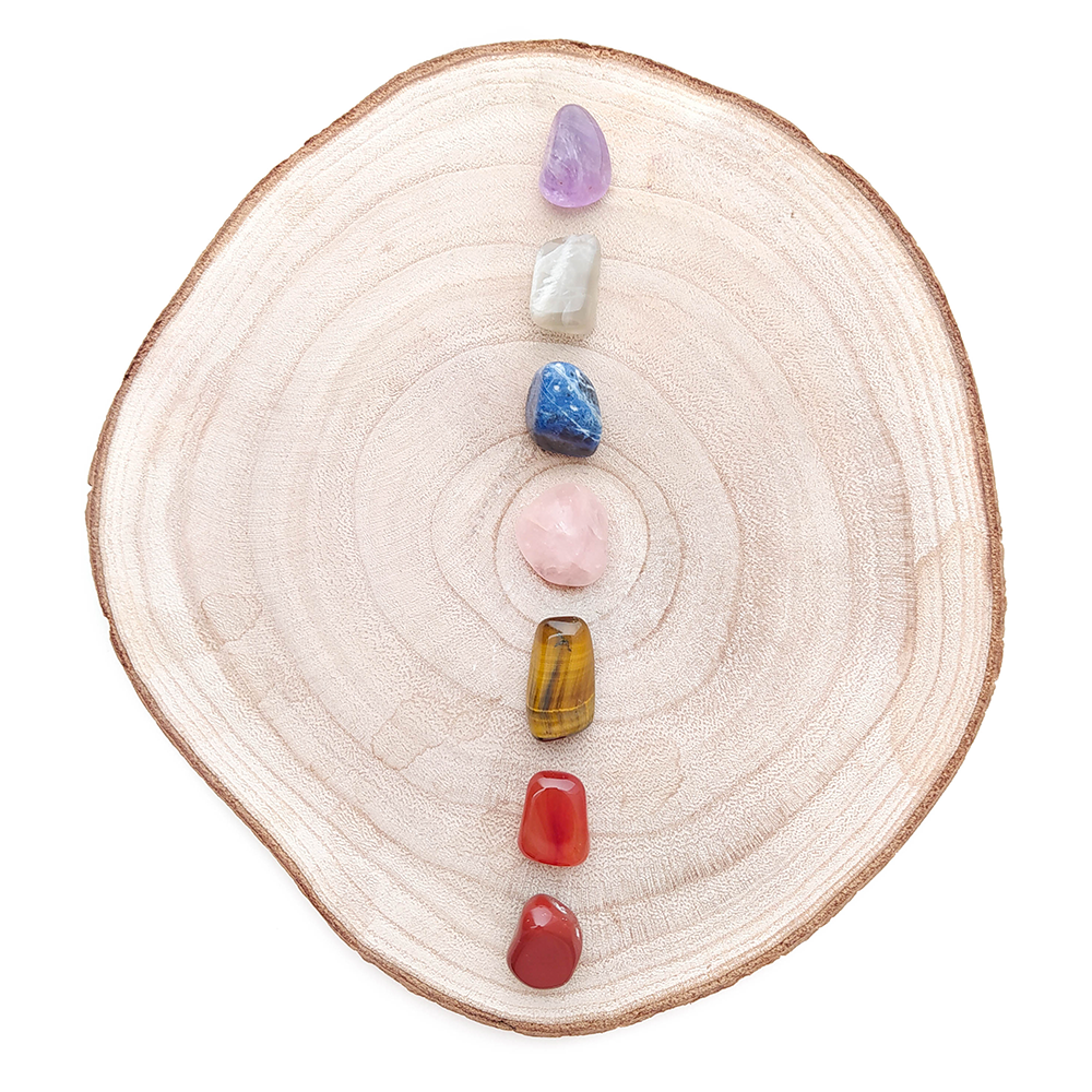 Kit de los Siete Chakras con cristales de cuarzo rosa y piedra de luna, incluye siete piezas para equilibrio espiritual.