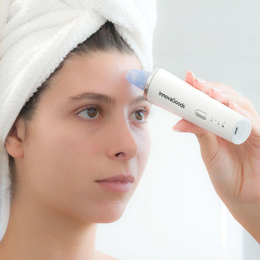 Limpiador facial eléctrico de puntos negros PureVac de innovagizmo, con cabezal removible y diseño ergonómico.