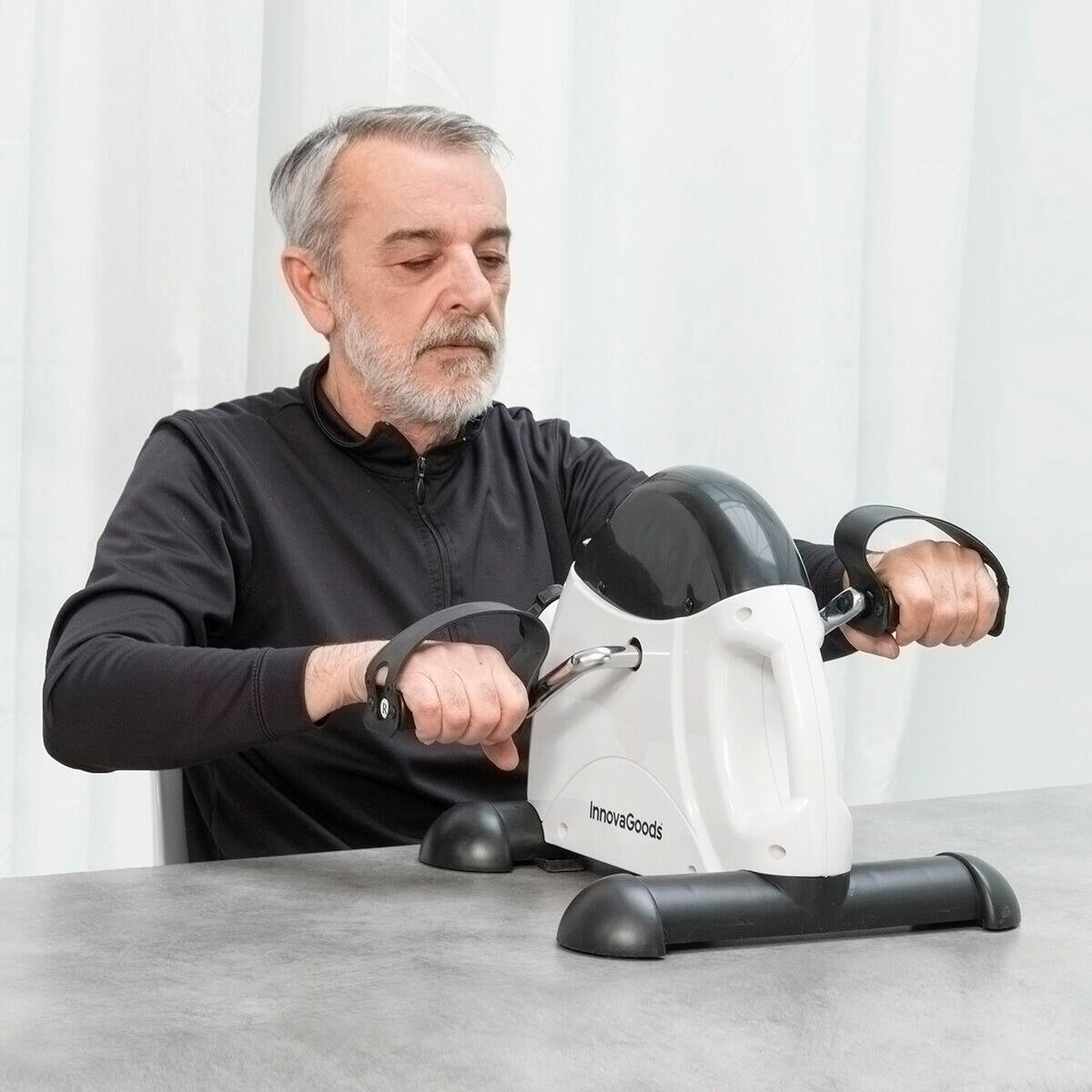 Pedaleador para brazos y piernas Fipex InnovaGoods, dispositivo de ejercicio portátil para tonificar músculos en casa.