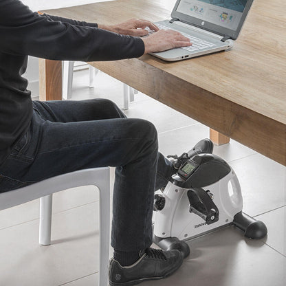 Pedaleador para brazos y piernas Fipex InnovaGoods, aparato de ejercicio compacto y portátil para entrenamiento en casa.
