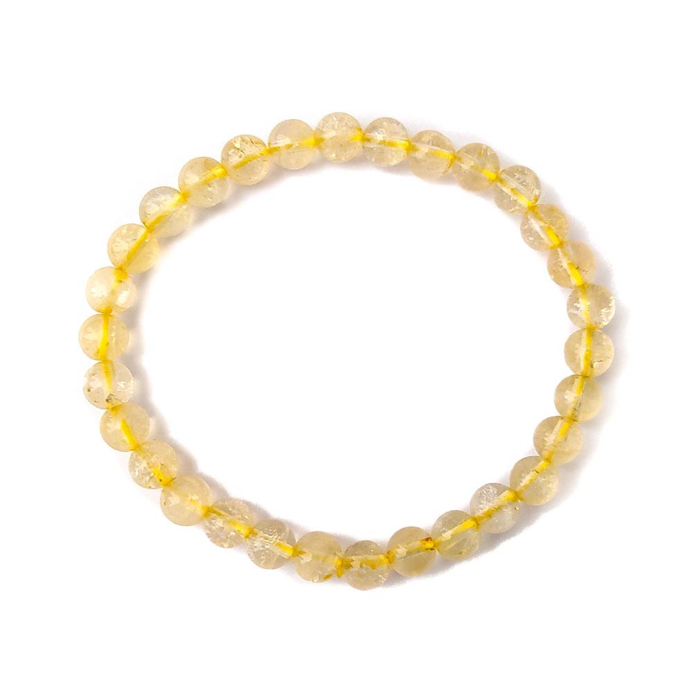 Pulsera de mineral de citrino potenciado con bolas lisas, de la marca Mystical Tienda, mostrando las cuentas redondas y brillo del citrino.