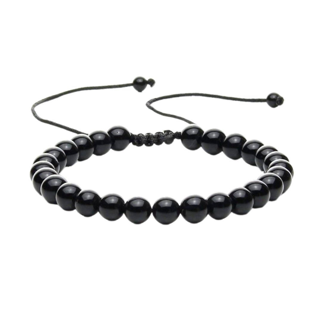 Pulsera de mineral ónix con nudo corredizo, accesorio elegante y natural, ideal para complementar estilos bohemios y modernos.