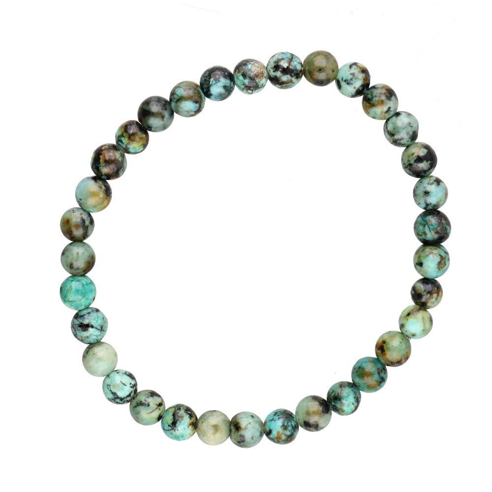 Pulsera de mineral con turquesa africana y detalles naturales, perfecta para accesorios de estilo bohemio.