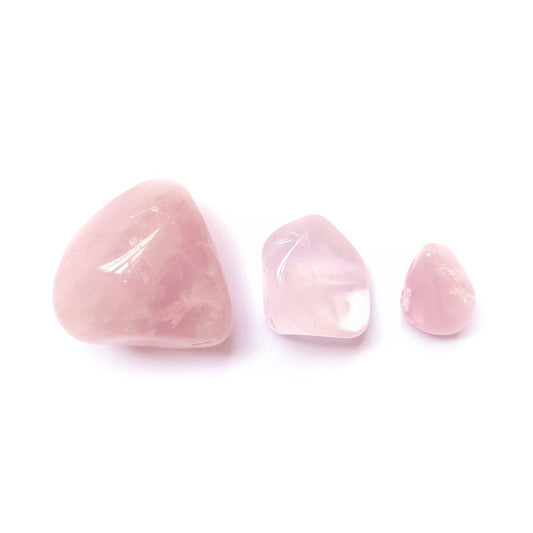 Rodado de cuarzo rosa de Mystical Tienda, piedra pulida y lisa, con tonos rosados suaves y superficie brillante.