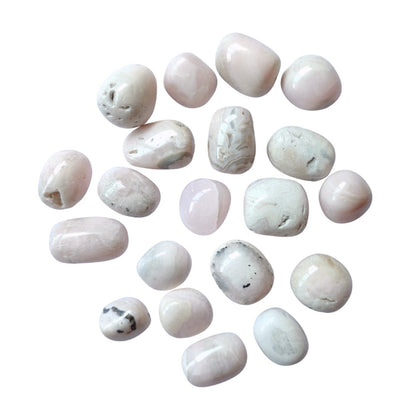 Rodado de manganocalcita de Mystical Tienda, muestra detalles y color de la piedra mineral en una superficie.
