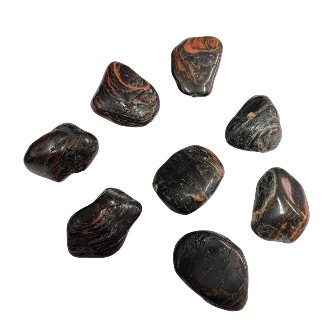 Rodado de turmalina negra de Mystical Tienda, pieza redonda y pulida, con brillo oscuro y superficie lisa.