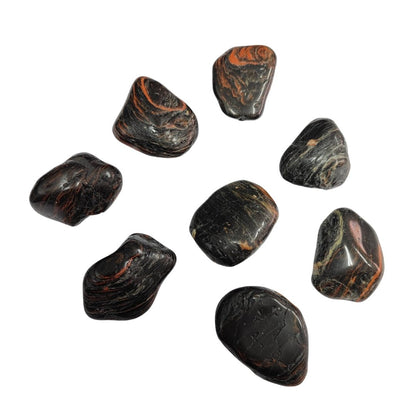 Rodado de turmalina negra de Mystical Tienda, pieza redonda y pulida, con brillo oscuro y superficie lisa.