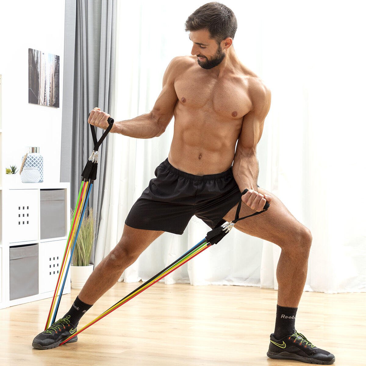 Set de 5 bandas de resistencia Innovagizmo con accesorios y guía de ejercicios para entrenamiento en casa.