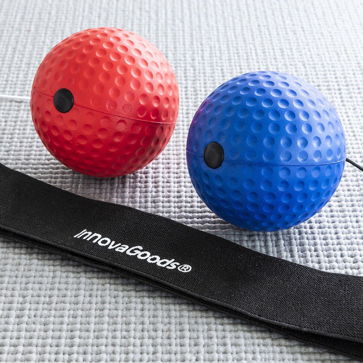 Set de pelotas de entrenamiento y reflejos Balxing Innovagizmo, color amarillo y negro, con varias pelotas de diferentes tamaños.